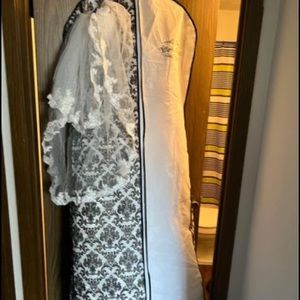 Wedding dress it’s white and come with a vail needs to be gone by next week